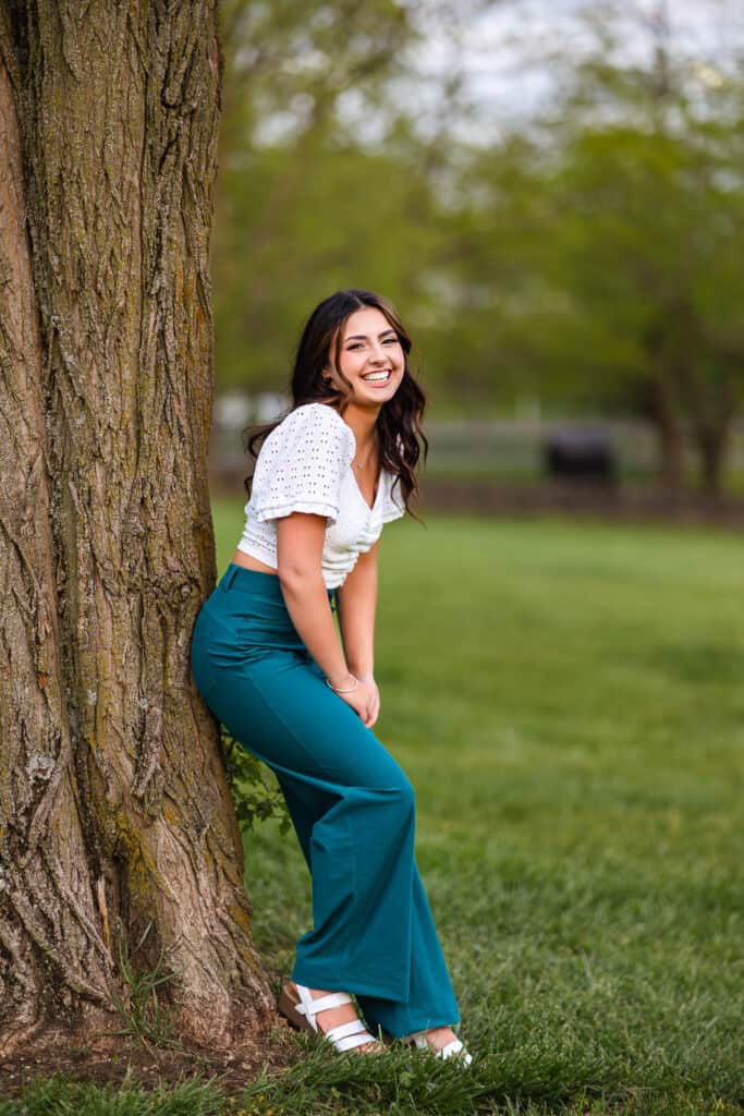 Laughing Girl On Tree Lexington Senior Photographer