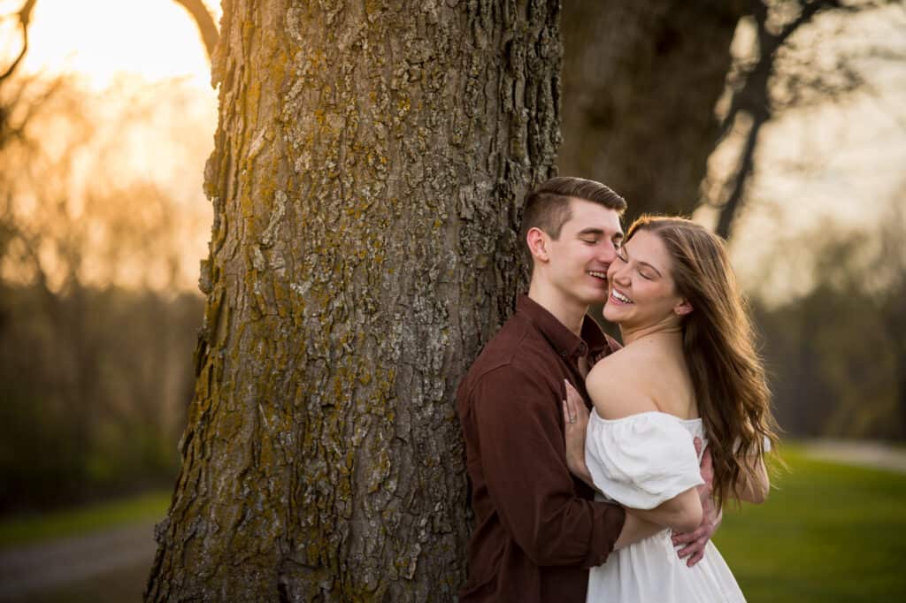 Couple Laughing Against Tree At Shaker Village