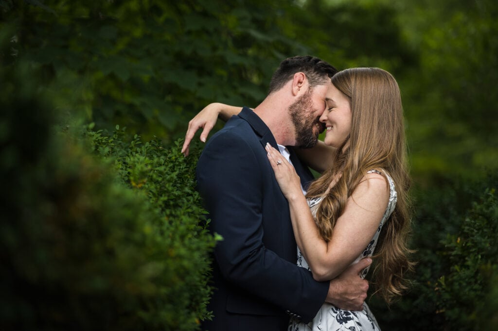 A couple embraces in Frankfort, KY during their engagement session.
