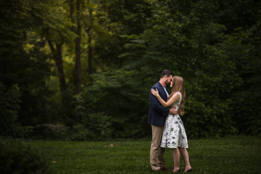 A couple kisses during their engagement session in Frankfort, KY.