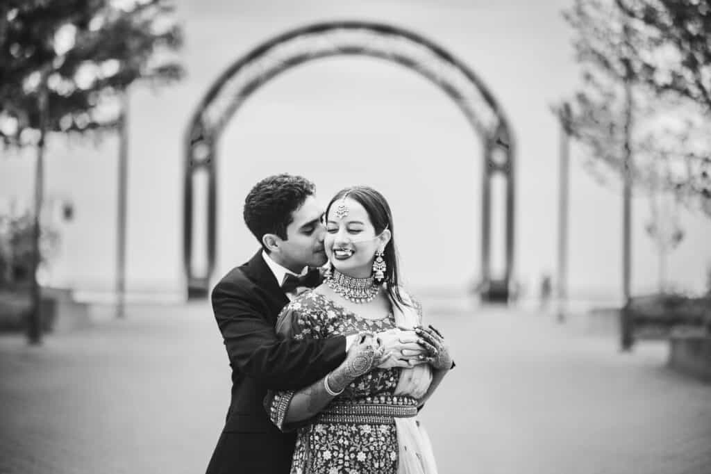 Sana and Kevin posing by Ohio River Riverfront during their Nikkah pre-ceremony shoot in Louisville.