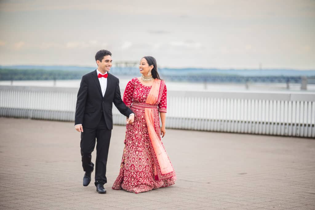Sana and Kevin posing by Ohio River Riverfront during their Nikkah pre-ceremony shoot in Louisville.