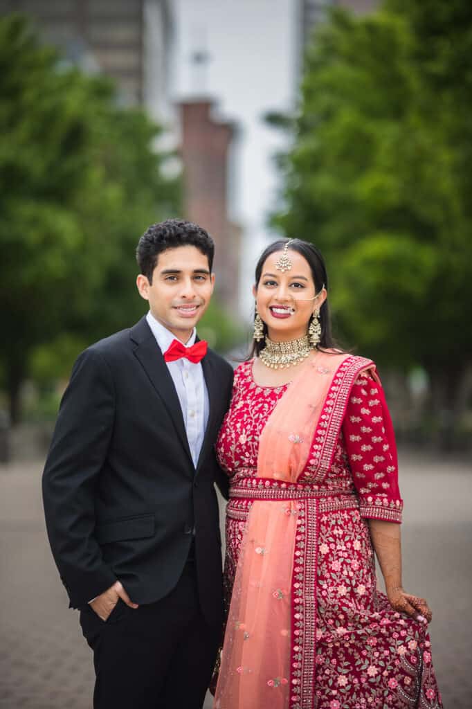Sana and Kevin posing in front of Lousiville skyline during their Nikkah pre-ceremony shoot in Louisville.
