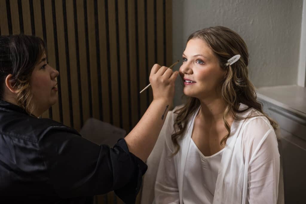 A Harper Hall bride receiving makeup services for her wedding.