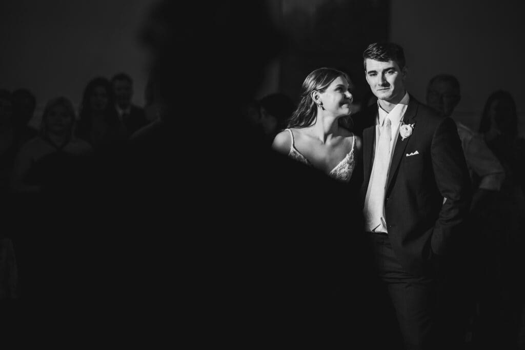 A black and white photo of a bride and groom in Harper Hall.