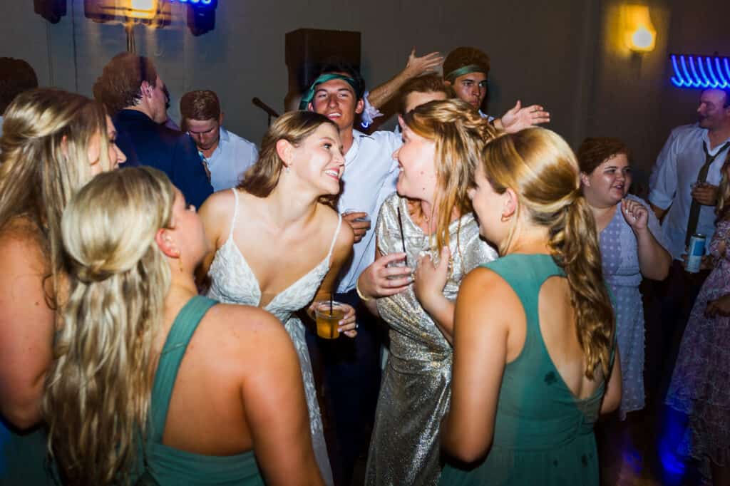 A group of bridesmaids dancing at Harper Hall Wedding.
