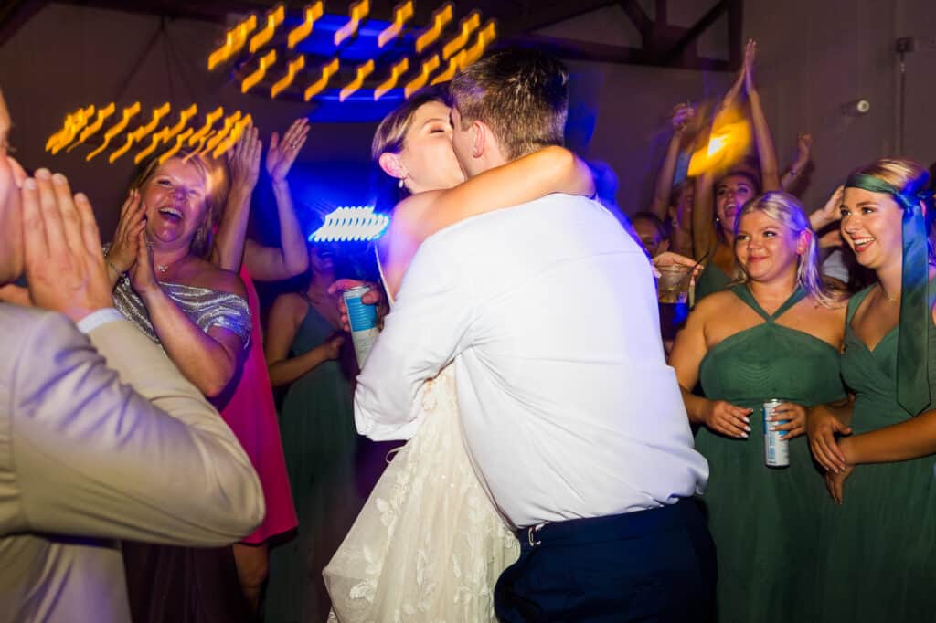 A Harper Hall bride and groom hugging at their wedding reception.