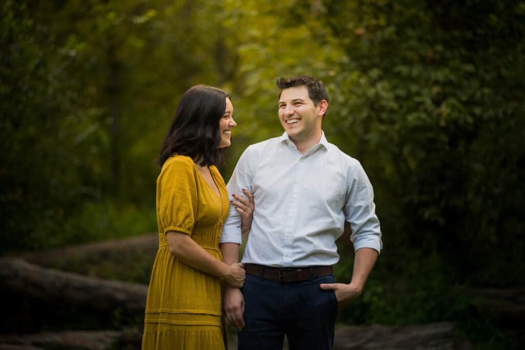 An Engaged Couple Laughing During Jacobson Park Engagement Photos.
