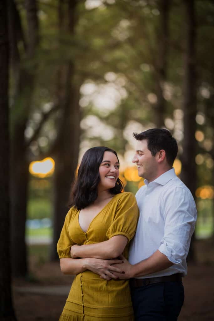 A Couple Embraces During Their Jacobson Park Engagement Session.