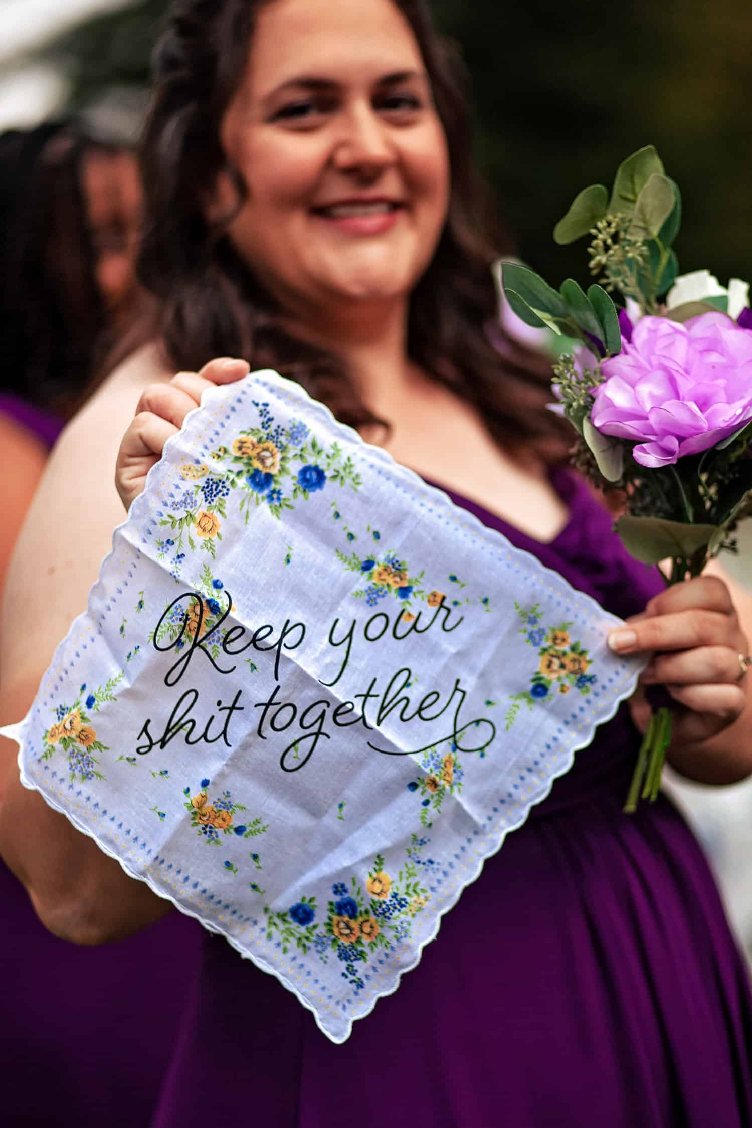 A bride holding a handkerchief with the words keep your shit together.