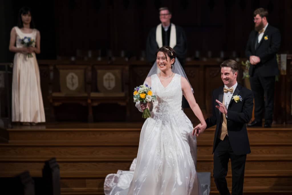 A Micro Wedding In A Church With A Bride And Groom Walking Down The Aisle In Lexington, Ky.