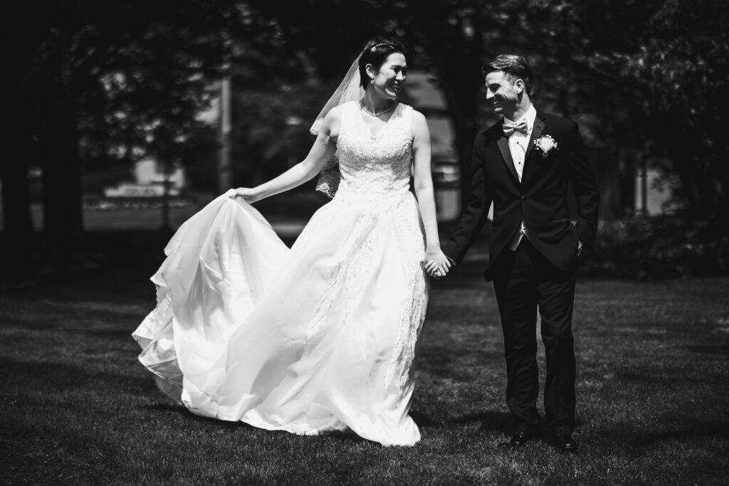 Black And White Micro Wedding Photo Of A Bride And Groom Holding Hands In Lexington, Ky.