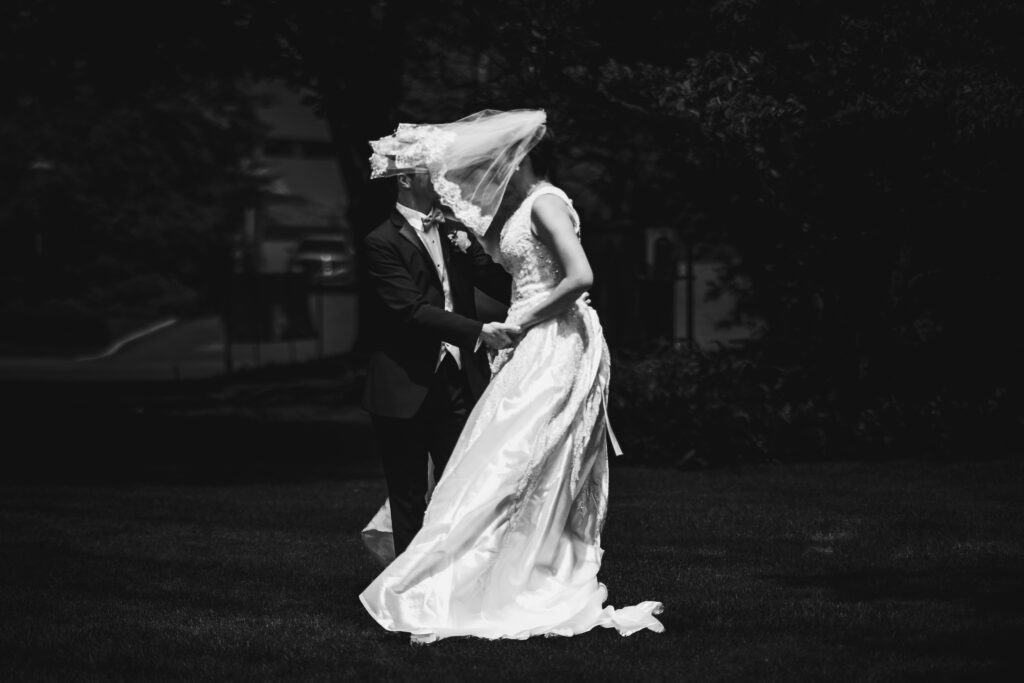 A Black And White Photo Of A Bride And Groom Kissing At A Micro Wedding In Lexington, Ky.