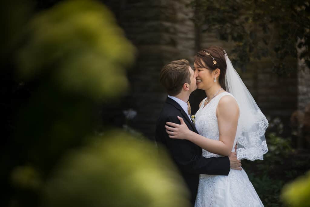A Micro Wedding With A Bride And Groom Kissing In A Garden In Lexington, Ky.