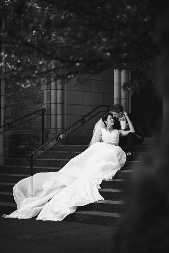 A Micro Wedding Couple Sitting On The Steps Of A Church In Lexington, Ky.