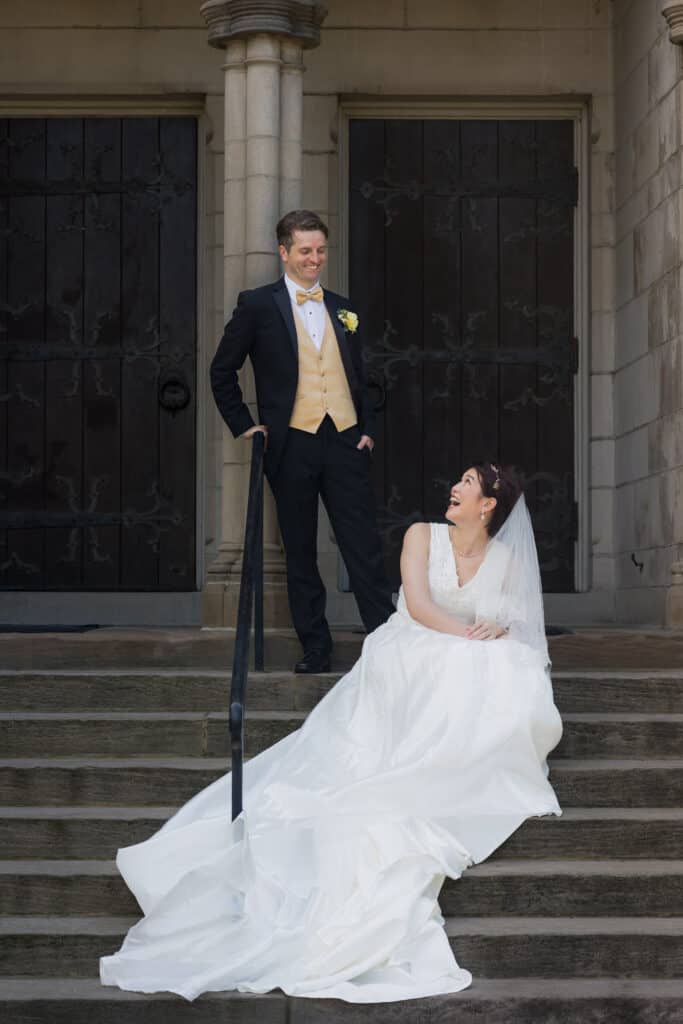 A Couple Poses On The Steps Of A Building During Their Micro Wedding In Lexington, Ky.