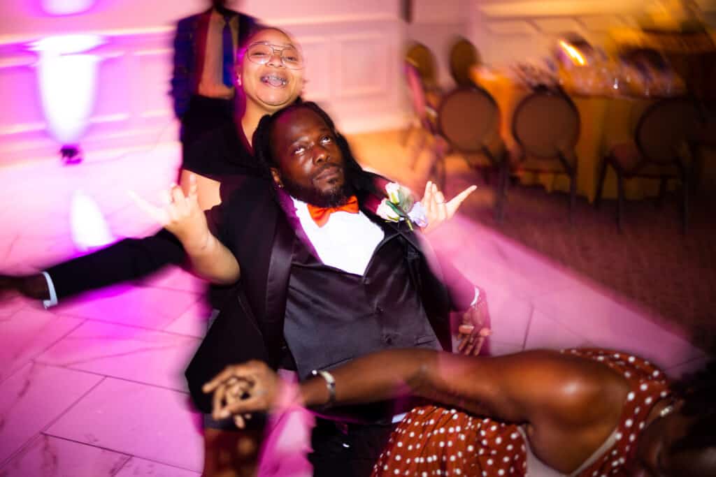Lexington Ky Photographers Capturing A Man And Woman Dancing At A Wedding Reception.