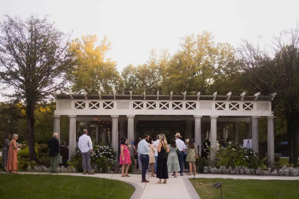 A group of people standing in front of a gazebo at a Kentucky event.