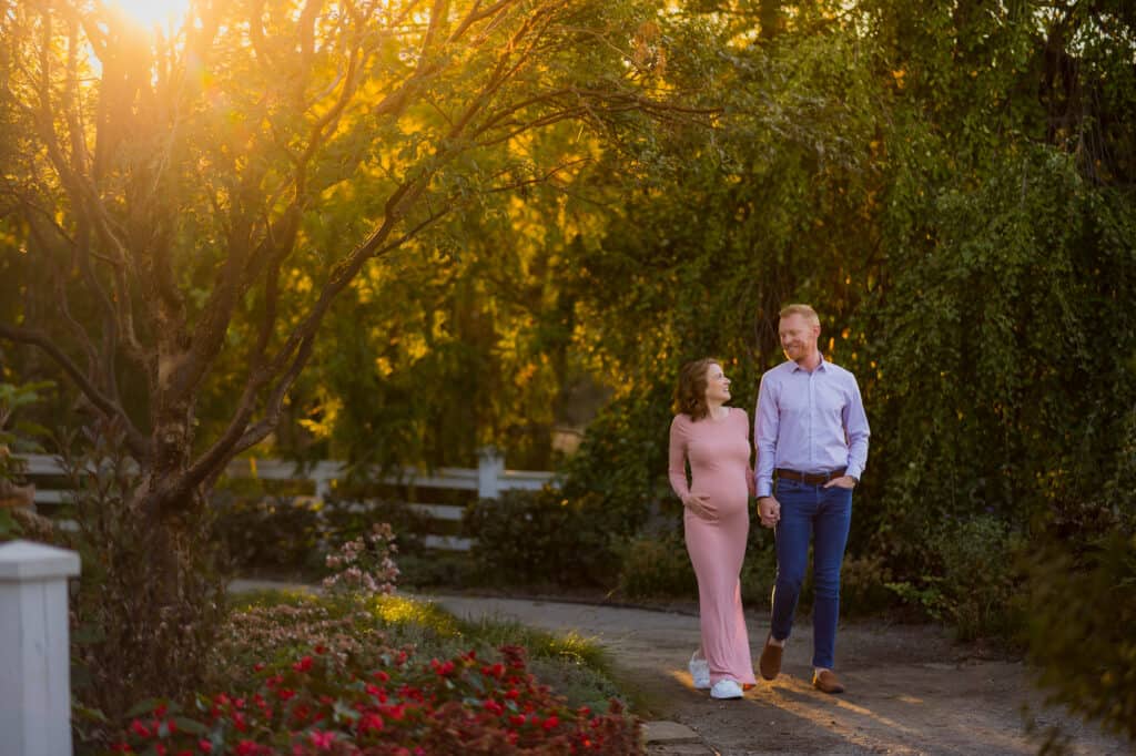 A couple walking through a garden at sunset in Lexington, KY.