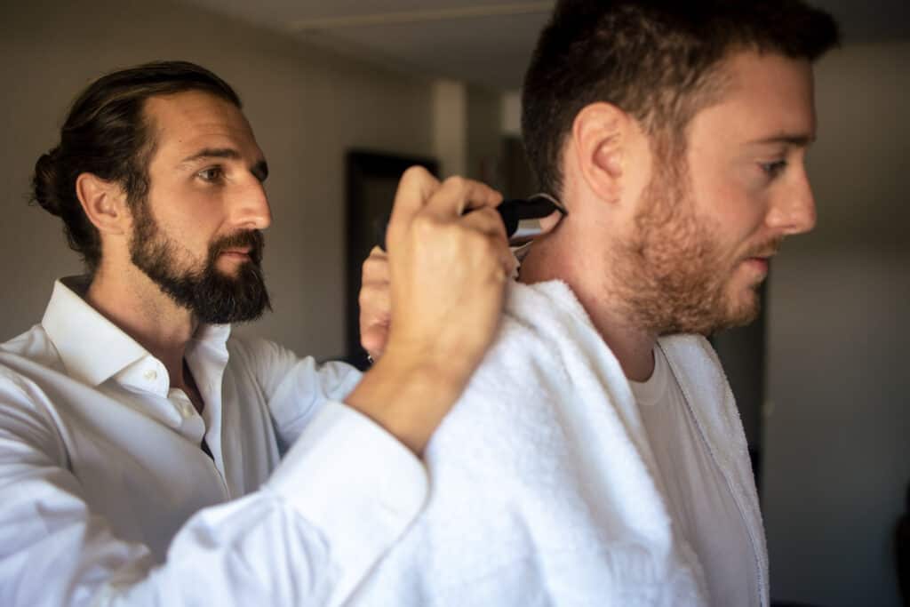 Groom getting haircut in Frankfort Wedding
