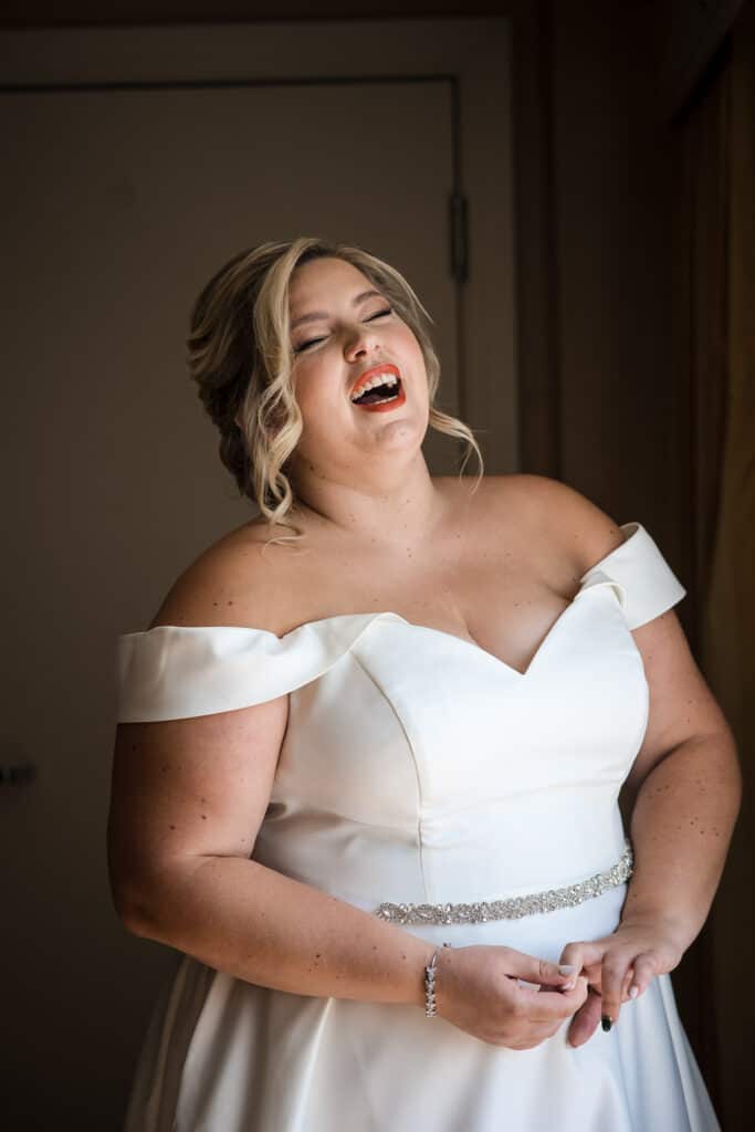 bride laughing in Louisville hotel